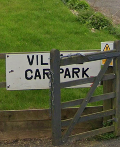 Old village hall car park entrance sign