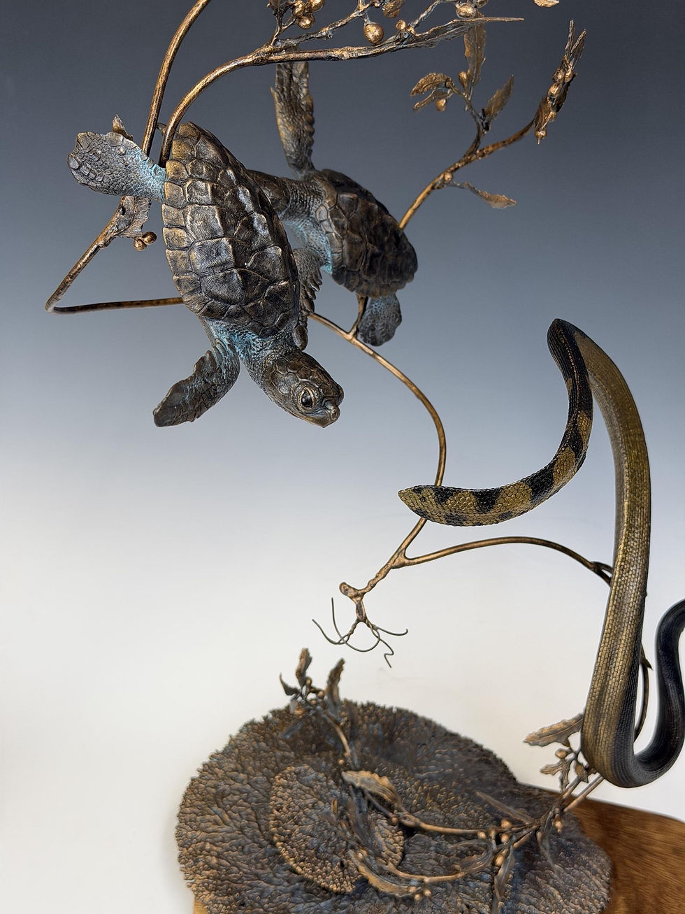 A Delicate Balance, by Jennifer Cook, is an elegant under-sea sculpture of sea turtles and asea snake in fluid motion