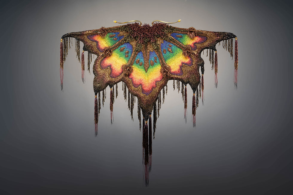 Nearing the Light, by James Talbot. Exquisite bead work wings in multicolors