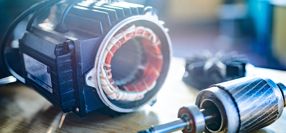 Close-up of an iron industrial motor lies on a table during the production of new modern t