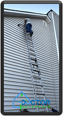 Ductor Clean Air technician on a tall ladder performing high-reach dryer vent cleaning for an Atlanta home.