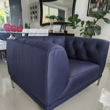 Professionally reupholstered leather armchair in Miami, showcasing quality leather upholstery and detailed craftsmanship.