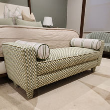Bed-end ottoman reupholstered in geometric patterned fabric in Miami, coordinated with the bedroom decor.