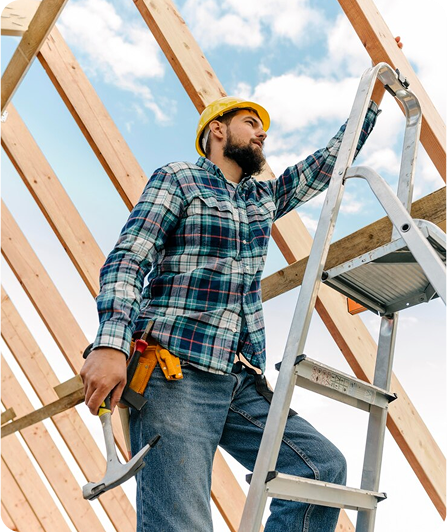 Construction worker on ladder, holding hammer, new home building