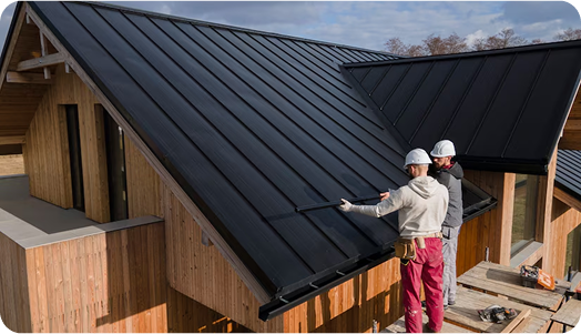 Roofers inspect new black metal roof