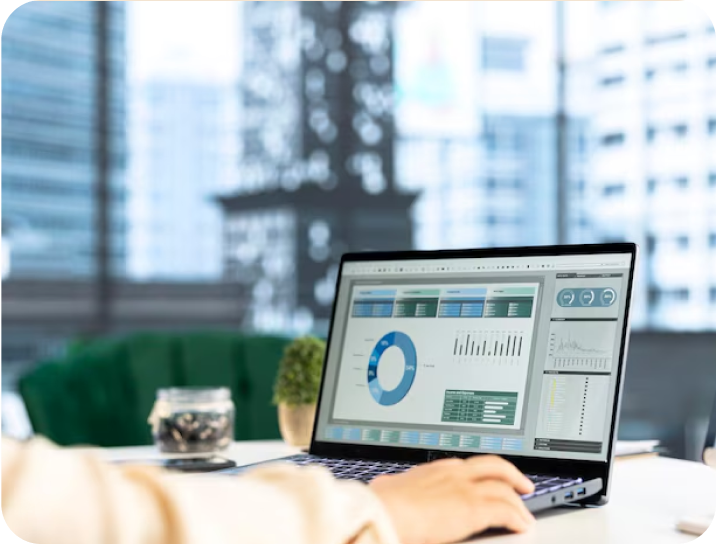 Person reviewing data charts on laptop