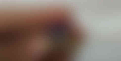 A white, purple and gold crown with a white background