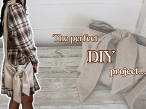 Person in plaid dress with a fabric bag tied on the side. Rustic wood floor. Text: The perfect DIY project...