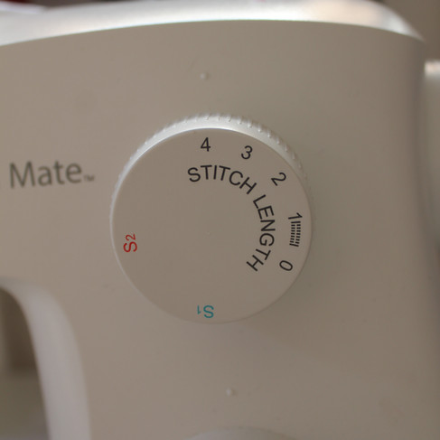the stitch length dial on a sewing machine