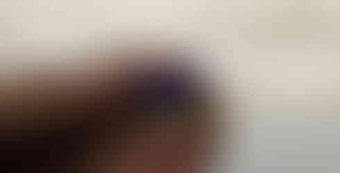 A white, purple and gold crown with a white background