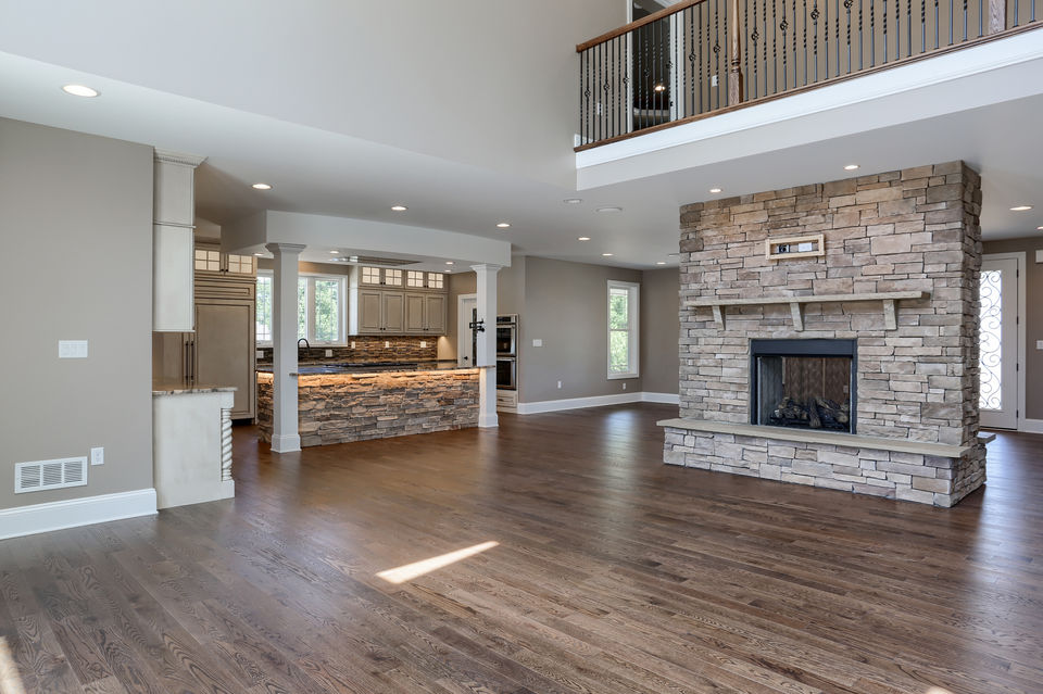 great room with double sided stone fireplace