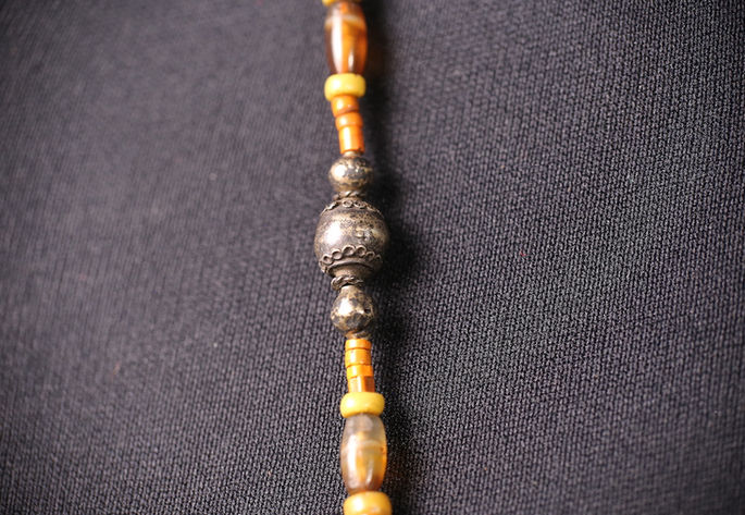 Samfufok beads with in-inti, napuchaw, and barrel-shaped agate beads called asi