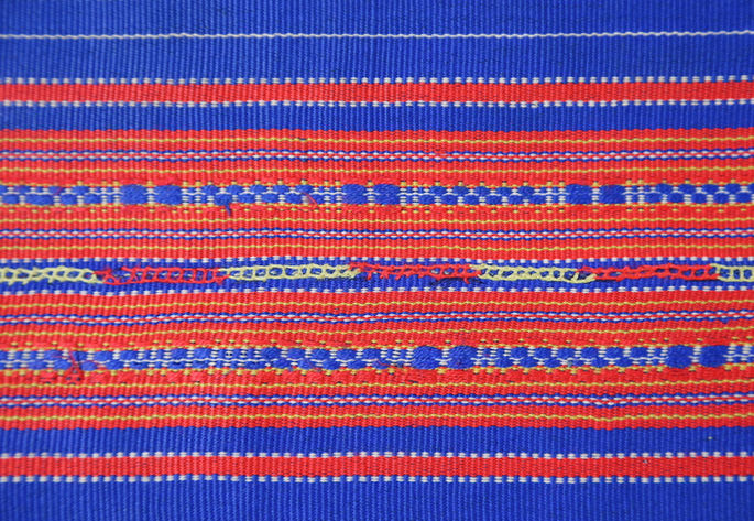 Red and yellow embroidery were used to join the panels of the skirt