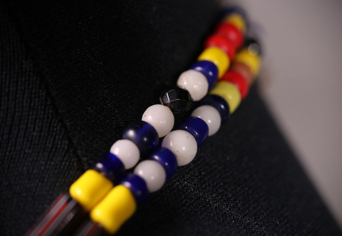 Prussian blue beads and multifaceted black beads alternated with rounded white glass beads