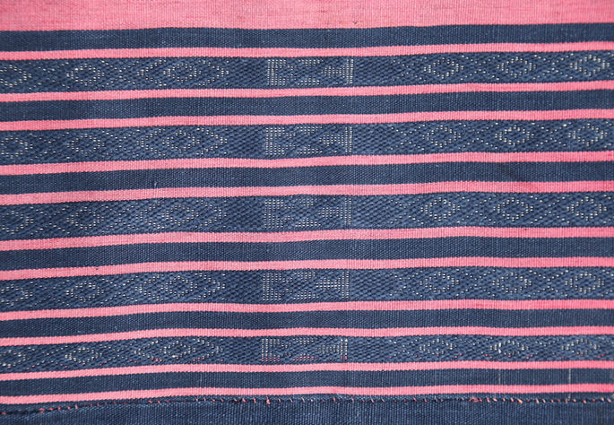 Thin bands embedded with Xs, diamonds, and human figure motifs