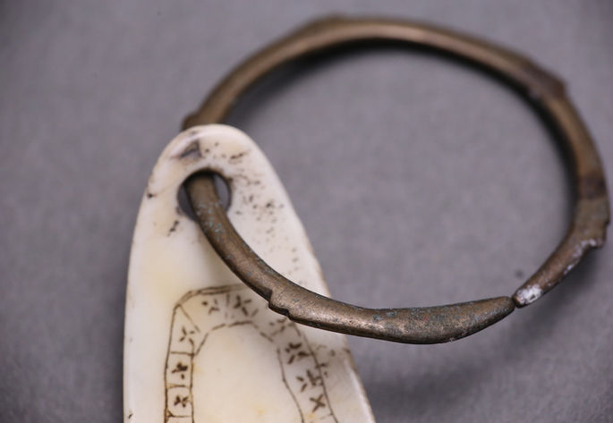 The metal ring was looped through the hole at the tip of the shell