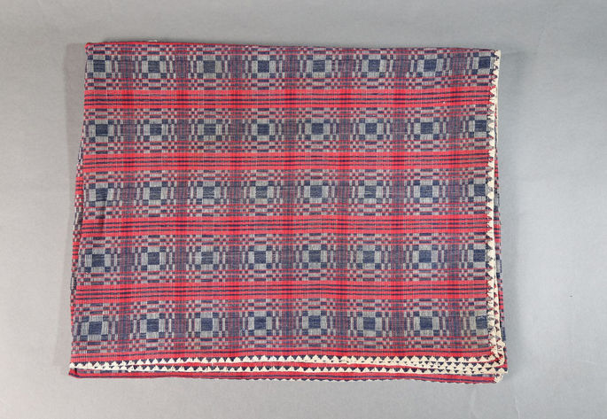 A hero shot of a binakol textile featuring the whirlpool/whirlwind design and embroidered borders.