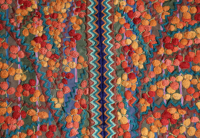 The two panels of this skirt are joined by an embroidery design featuring a continuous diamond pattern