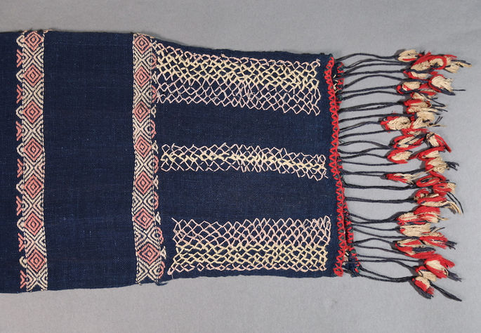 A close-up shot of the embellishments—brocade-woven, embroidered, and sewn—on the textile