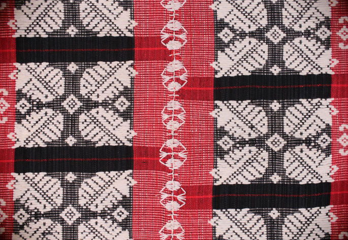 A closer look at the white embroidered joinery.