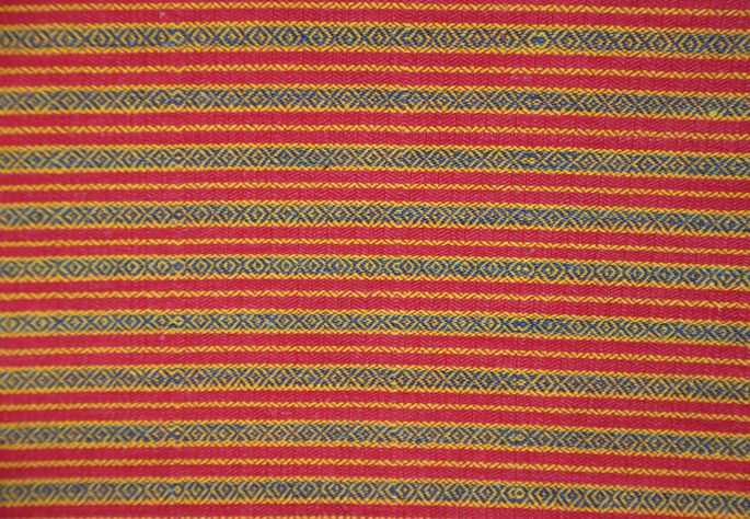 Stripes featuring intricate X and diamond motifs arranged in an alternating pattern