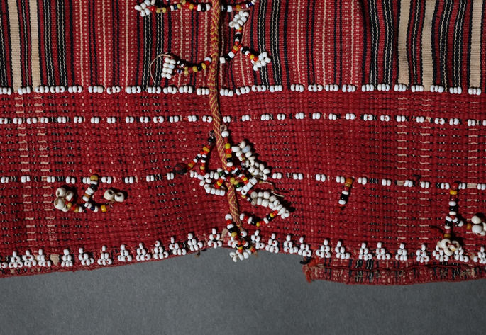 A closer look at the dangling beadwork featuring multi-colored beads