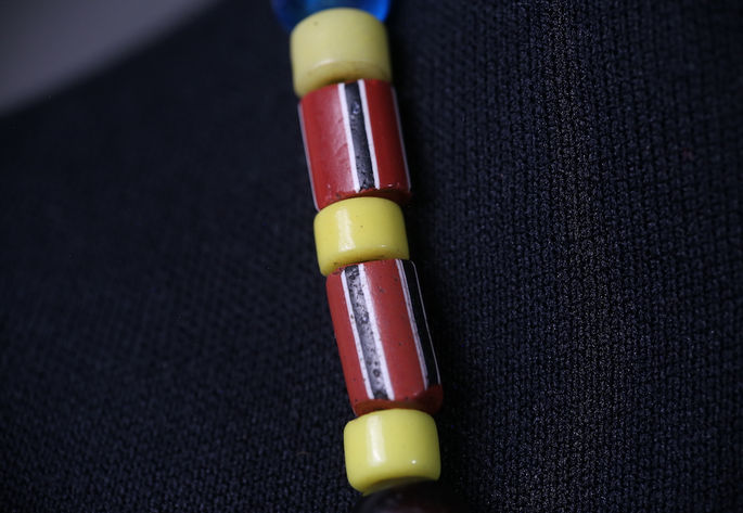 Opaque red glass beads with stripes (pinispisao) and yellow flat-disk beads (bacao)