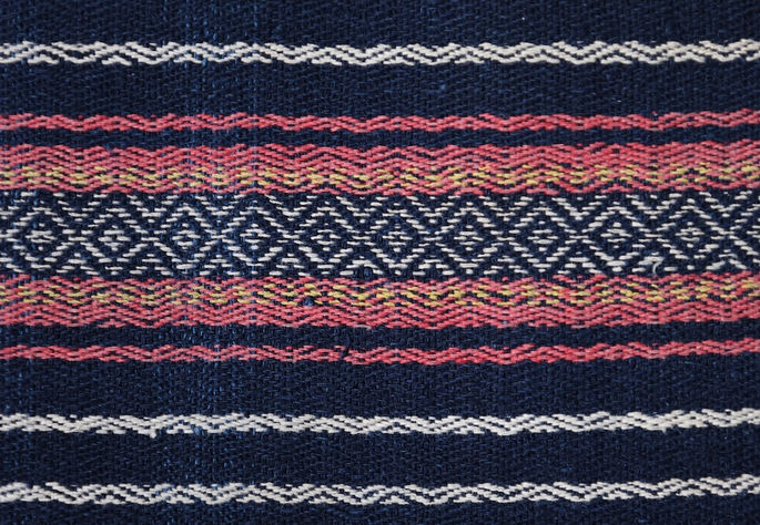 A close-up shot featuring white diamond patterns on an indigo background