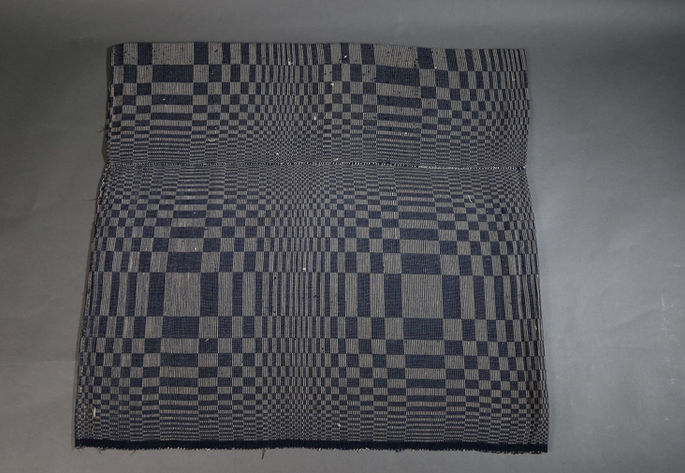 A hero shot of a binakol blanket with large sphere-like patterns.