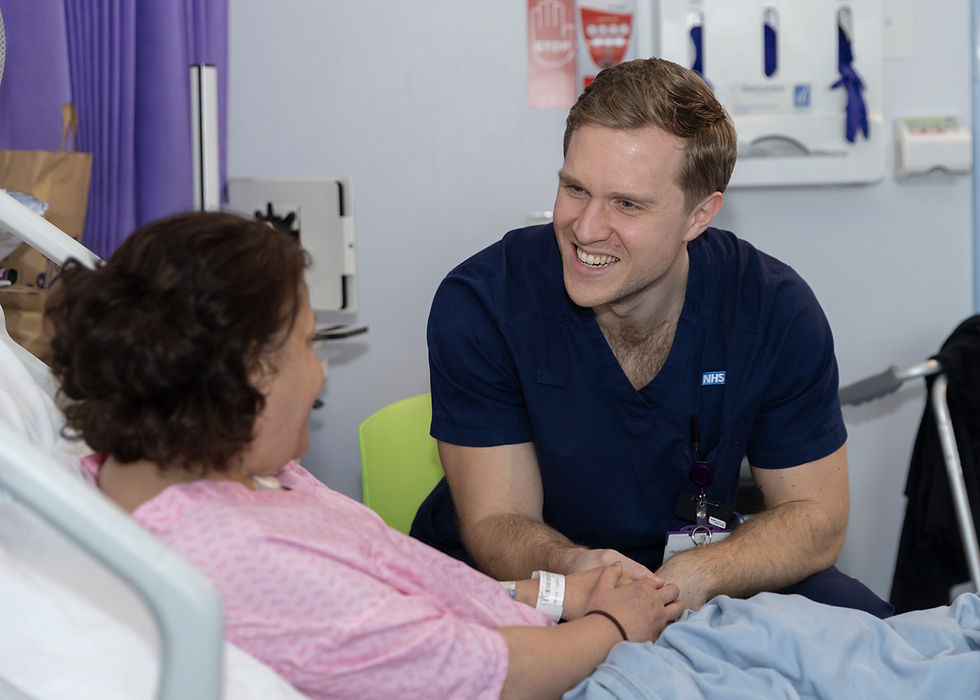 LHCH nurse speaking to a patient