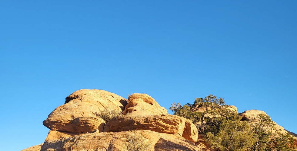 A stack of sandstone rocks in a desert.