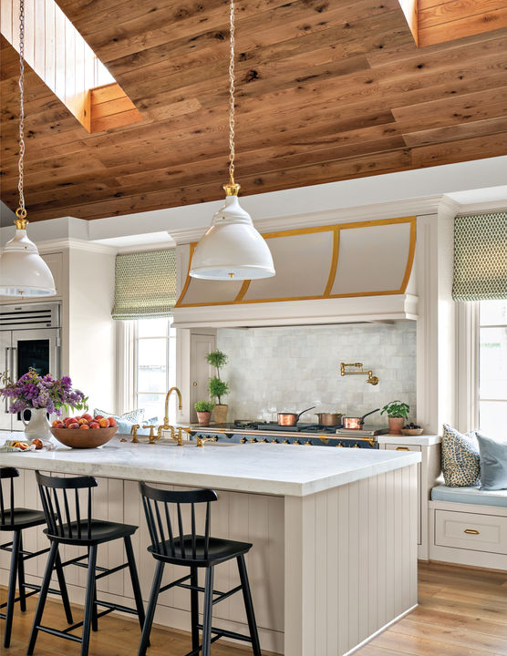 Grand kitchen cooktop and island at Woods Edge in Piney Point Village