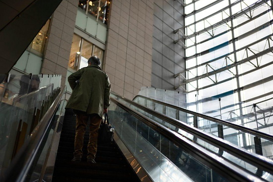 a rolling stair inside a tall building