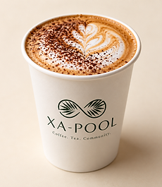 Cappuccino with cocoa and latte art in a white XA-POOL Café cup