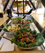 Buffet line with three fresh salads