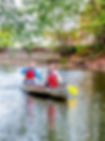 Two girls canoeing with Camp Hi on the Cuyahoga River.