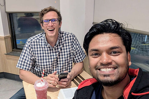 Pastor Mark DeVos and new Village Church member studying the Bible together at Tim Horton's.