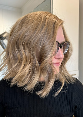 Warm golden blonde tone with blended lowlights and hand-tied extensions created by Stewart Hair, Roswell GA salon for expert