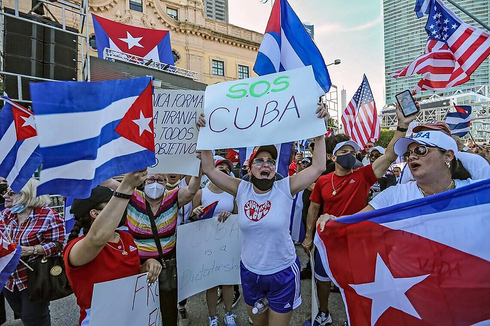 Protest gather during Rally for Democracy in Cuba at Miami Dade College's Freedom Tower, in Miami on Saturday, July 17, 2021. (Al Diaz/Miami Herald/TNS)