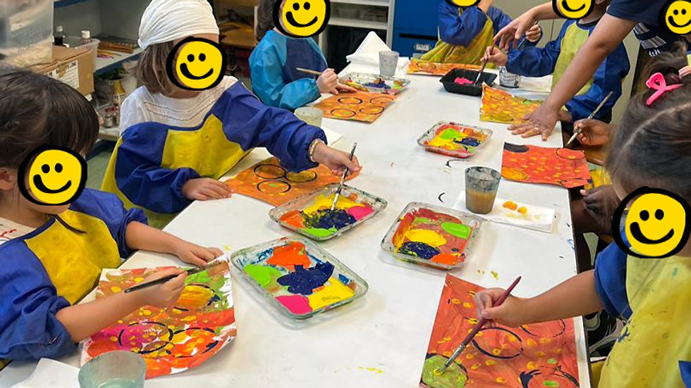 High angle view of children engaged in an art class, focused on their projects