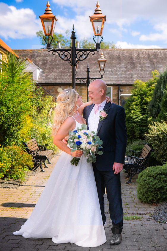Bride & Groom pose for wedding photography in Teesside