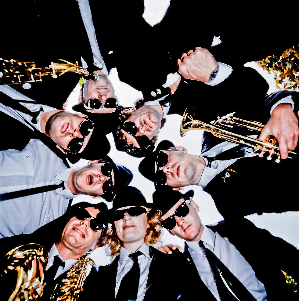 Eye-level view of a professional photographer taking a corporate team photo in an office