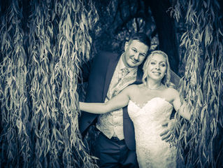 Wedding couple photographed by a Willow tree