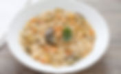 Risotto ai carciofi violetti e scalogni dolci con code di scampi arrostite al timo sfumate al Lugana