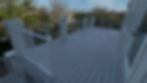 Modern grey composite deck with white cable railing systems
