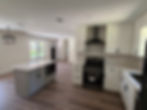 Modern kitchen with white cabinets and grey island