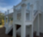 Modern white deck with cable railings and stairs