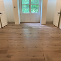 Bedroom with new wood floors and trim