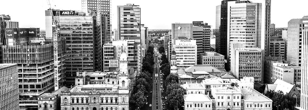 gray concrete road near high-rise buildi