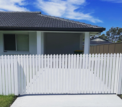 Installation of white picket fence. We can also install colourbond across any property in Brisbane 